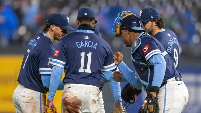 Kansas City Royals shortstop Bobby Witt Jr. (7), third baseman Maikel Garcia (11), first baseman Vinnie Pasquantino (9) and catcher Salvador Perez (13) celebrate an 8-2 victory over the Baltimore Orioles on Friday, April 4, 2025, at Kauffman Stadium.